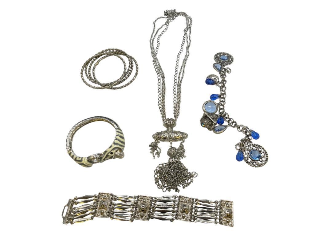 SILVER TONED COSTUME JEWELRY INCLUDING STATEMENT NECKLACE, SET OF BANGLES, FIGURAL ZEBRA, AND MORE: GREAT COLLECTION OF BRIGHT SILVER TONED JEWELRY