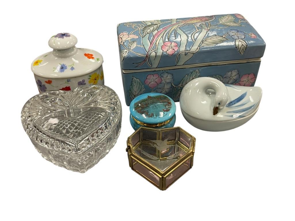 SIX DECORATIVE PORELAIN AND GLASS STORAGE CONTAINERS: HEART SHAPED GLASS STORAGE CONTAINERS, SWAN FIGURAL STORAGE CONTAINER, ROUND STONE PILL BOX, RECTANGULAR LARGE STORAGE CONTAINER, AND OBLONG STORAGE CONTAINER 2 1/2" UP TO 8"