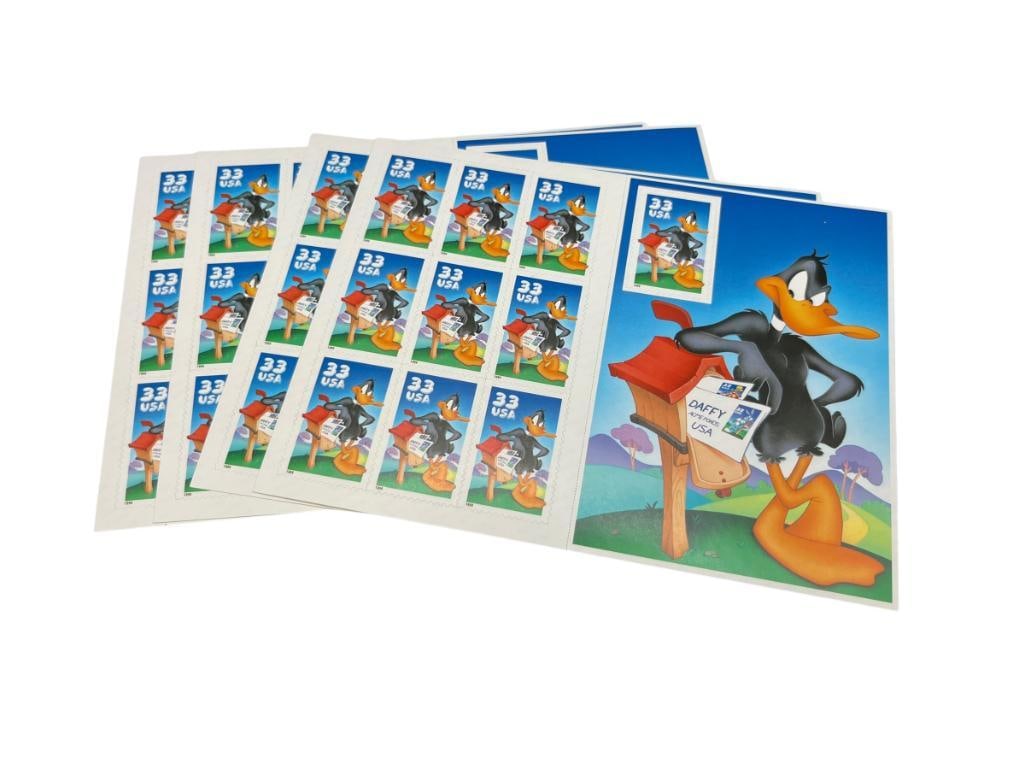 FOUR MINT UNCUT SHEETS OF 1999 U.S. DAFFY DUCK LOONEY TUNES 33 CENT STAMPS: $13.20 FACE VALUE, FEATURING BUGS BUNNY STAMPERS DETAIL ON BACK