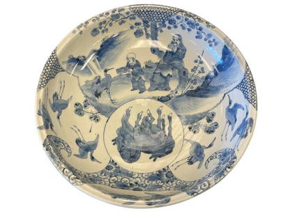 LARGE 20TH CENTURY JAPANESE PORCELAIN BOWL, BLUE AND WHITE DECORATED BOWL WITH IMAGERY: JAPANESE ANTIQUE BOWL WITH IMAGERY IN BLUE AND WHITE, ART DEPICTS SCHOLAR WITH CHILD SURROUNDED BY VARIOUS ANIMALS SUCH AS EGRETS AND HORSES WITH WATERFALL IN BACKGROUND, EXTERIOR OF BOWL ALSO IS DECO