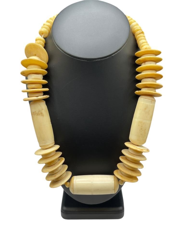 VINTAGE AFRICAN CARVED BONE TRIBAL NECKLACE: FEATURING VARIOUS SHAPED CARVED BEADS 20", UP TO 2 1/4" BEADS