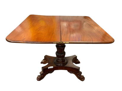 19TH CENTURY LATE GREGORIAN MAHOGANY GAME TABLE WITH PAW FEET: SWIVEL OPEN TOP GAME TABLE CONSTRUCTED FROM MAHOGANY WITH PAW FEET WITH LEAF CARVINGS AND DECORATIVE LEAF CARVED PEDESTAL 36" X 36" X 29"