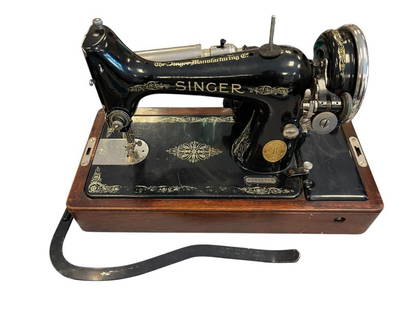 20TH CENTURY SINGER ELECTRIC PORTABLE SEWING MACHINE IN WOOD CASE, SERIAL AC511768: BLACK GILT DECORATED SINGER SEWING MACHINE, INCLUDES POWER CORD OIL CAN AND ACCESSORIES BOX, TESTED + 17" X 8" X 13" &nbsp;