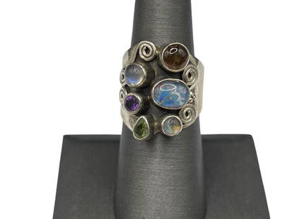 VINTAGE STERLING SILVER MULTI-GEMSTONE FASHION RING INCLUDING OPAL AND PERIDOT: ALSO INCLUDES MOONSTONE, AMETHYST, MOTHER OF PEARL, AND AMBER SIZE 7, 7/8" FRONT, 10.57 GRAMS