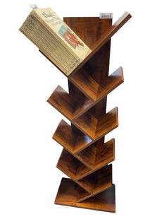 UNIQUE ALTERNATING ANGLE BOOK SHELF FEATURING SEVERAL TIERS OF CROSS HATCHED SHELVES: FEATURES A WOOD VENEER, IN GOOD CONDITION 54" H