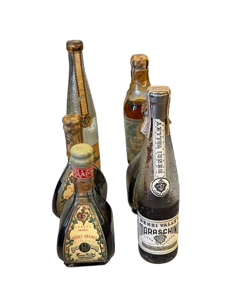 VINTAGE COLLECTIBLE 1/10 PINT MEXICO LIQUOR BOTTLES HENRI VALLET, BRESSON VERMOUTH, EUSTAQUIO IBA...: VINTAGE MEXICO 1/10 PINT GLASS LIQUOR BOTTLES, INCLUDES FOUR LIQUOR BOTTLES FROM HENRI VALLET, CHERRY AND PEACH BRANDY, MARASCHINO, BRESSON VERMOUTH, AND EUSTAQUIO IBARRA, ALL WITH ORIGINAL PAPER LABE