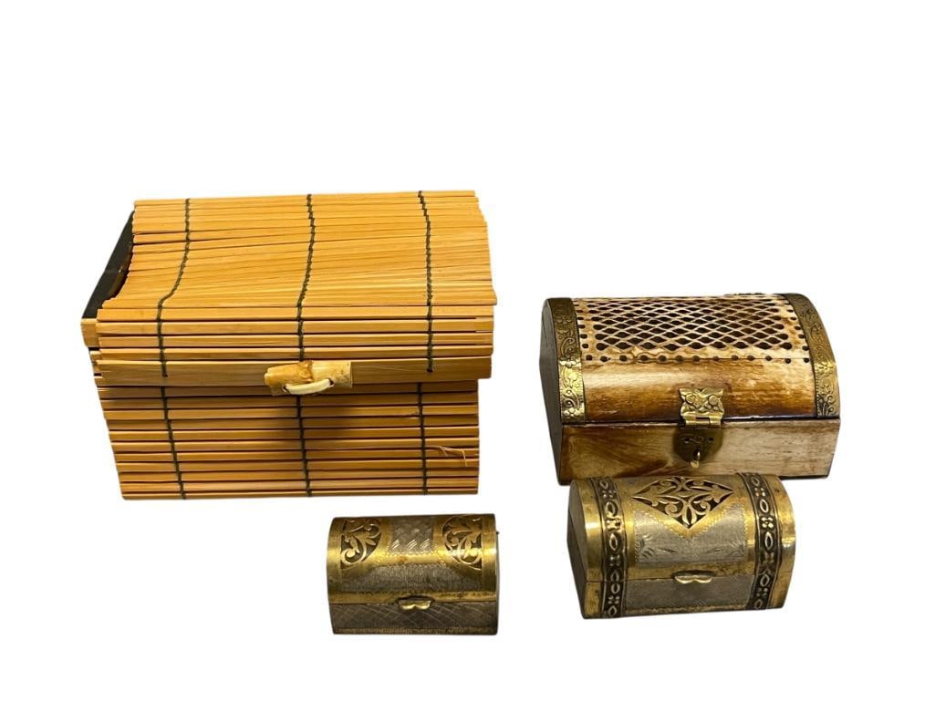 FOUR DECORATIVE TRINKET BOXES: BAMBOO TRINKET BOX, TWO ENGRAVED SILVER AND BRASS TRINKET BOXES WITH CLEAR PLASTIC LINERS,A ND INDIA CARVED BONE TRINKET BOX WITH DECORATIVE BRASS OVERLAY 2" UP TO 5"