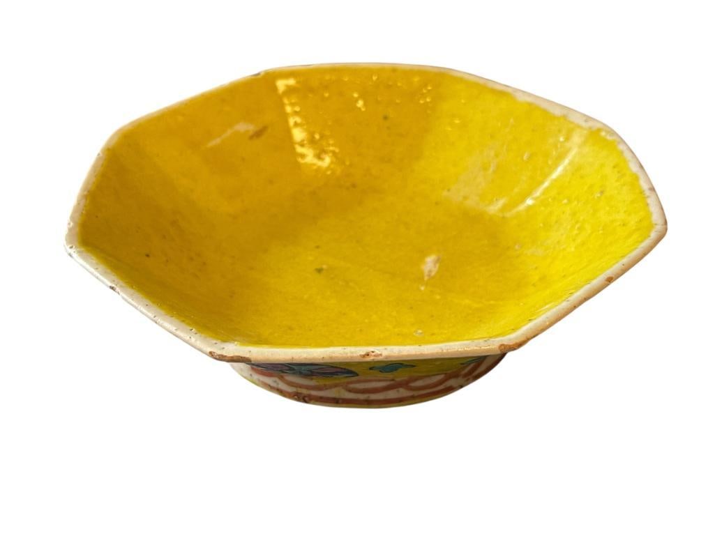 19TH CENTURY CHINESE PORCELAIN YELLOW GLAZE OCTAGONAL FOOTED BOWL: CHINESE PORCELAIN FOOTED PORCELAIN BOWL, PAINTED FLORAL AND GEOMETRIC DESIGN, NO MARKINGS 6"