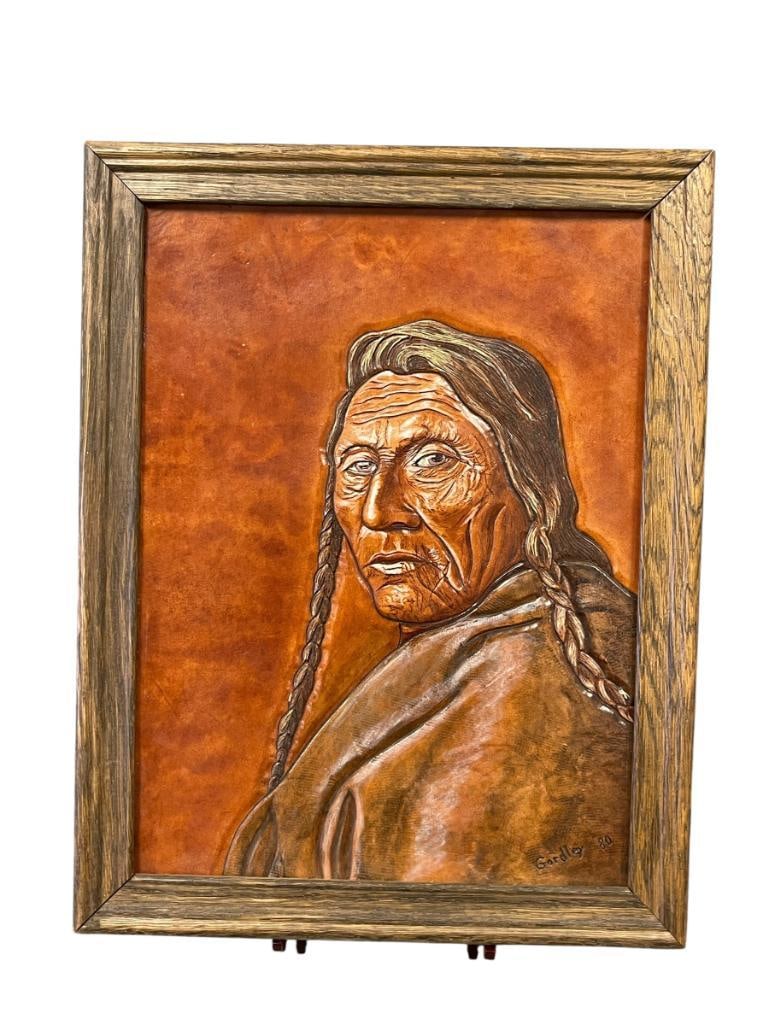 RICHARD AND NANNY GORDLEY TOOLED LEATHER NATIVE AMERICAN PORTRAIT TITLED HOLDING EAGLE DATED 1980: RICHARD AND NANNY GORDLEY NATIVE AMERICAN TOOLED LEATHER PORTRAIT, ART DEPICTS PORTRAIT OF ELDER NATIVE AMERICAN MAN TITLED HOLDING EAGLE, SIGNED LOWER RIGHT, ALSO SIGNED ONN REVERSE WITH ART TIT