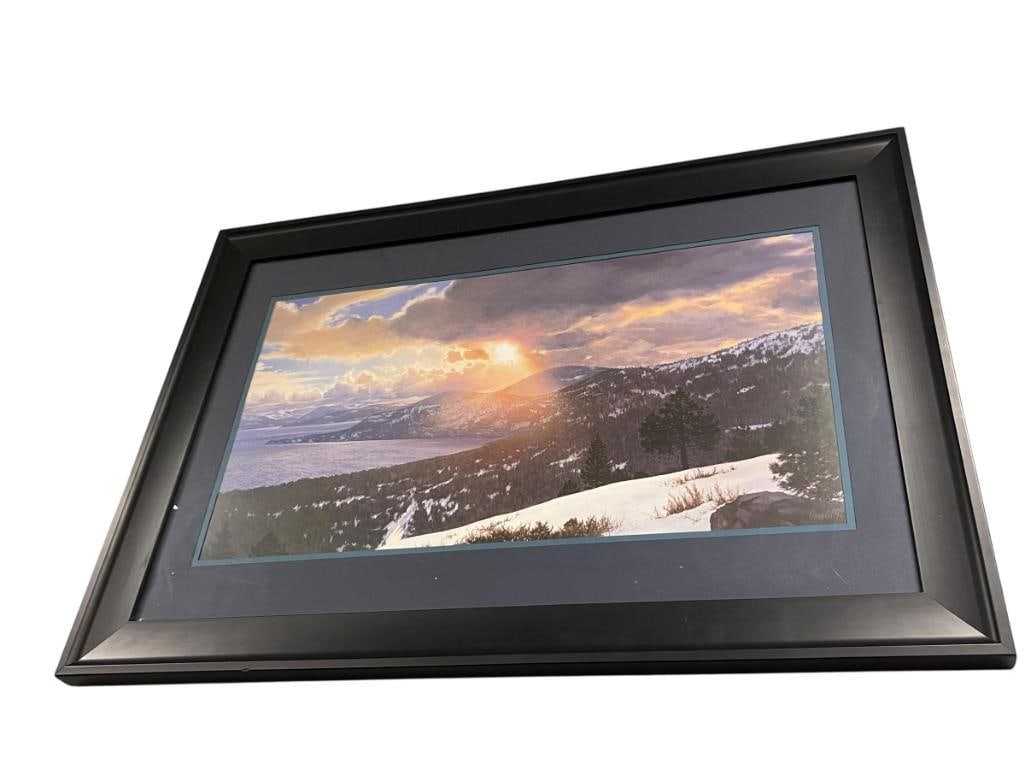 JEAN GUAY FRENCH CANADIAN, CALIFORNIA ARTIST LIMITED EDITION PRINT LAKE TAHOE TITLED A MISTY GLOW: JEAN GUAY (1930-2005) SETTLED IN SOUTHERN CALIFORNIA IN 1959, AND MOVED TO LAKE TAHOE ARE IN 1977, ART DEPICTS LAKE TAHOE HARBOR DUSK SCENE, SIGNED LOWER LEFT, SMALL CRACK TO GLASS LEFT CORNER, FRAMED