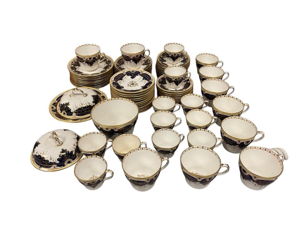 ENGLISH STAFFORDSHIRE COBALT BLUE AND GILT PATTERN CHINA SET: 73 PIECES TOTAL, COBALT BLUE AND GILT LEAF DESIGN, INCLUDES TEA CUPS, SALAD PLATES, DESSERT PLATES, SAUCERS, COVERED SERVING DISH, ETC., SHIPPING IS NOT OFFERED ON THIS ITEM, WE APOLOGIZE FOR THE INCO