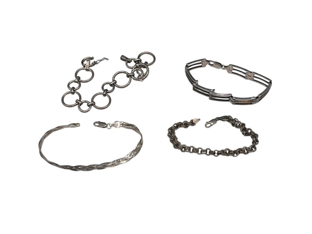 FOUR STERLING SILVER LINK BRACELETS INCLUDING SOME ITALIAN MADE: VARIOUS LENGTHS, APPROX. 40 GRAMS