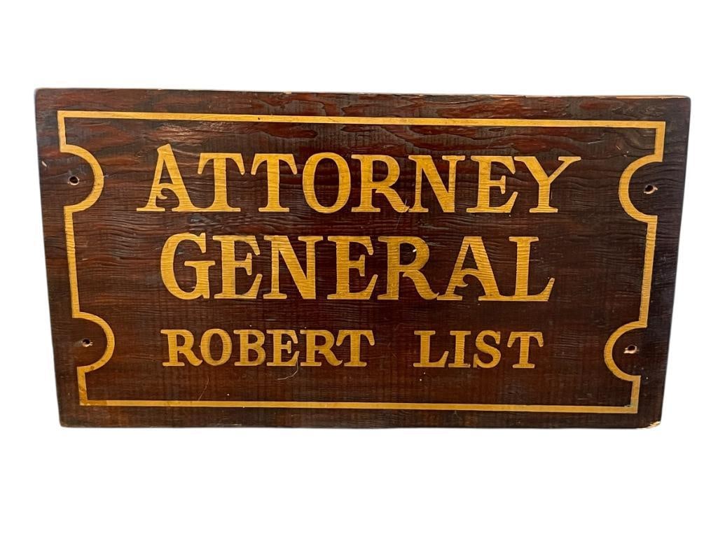 ROBERT FRANK LIST FORMER NEVADA ATTORNEY GENERAL FROM 1971-1979 WOODEN SIGN: DARK STAINED WOOD SIGN WITH GOLD LETTERING 17 3/4" X 9 7/8"