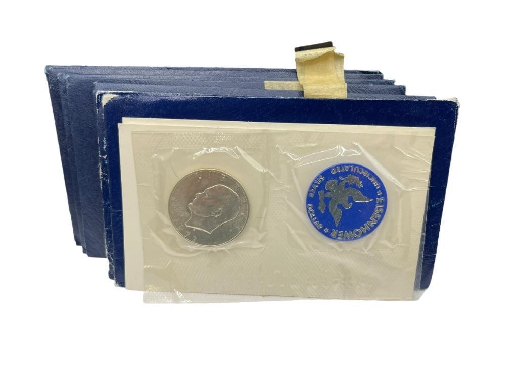 SEVEN U.S. EISENHOWER 40% SILVER UNCIRCULATED DOLLARS IN ORIGINAL ENVELOPES (1 of 8)