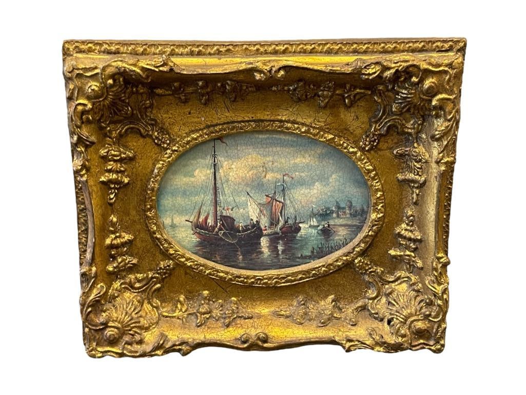 EARLY 20TH CENTURY STYLED TRANSFER ART ON BOARD OF SAILBOATS: ART DEPICTS SAILBOATS AND FISHING BOATS WITH TOWN IN THE BACKGROUND, FRAMED 11 3/8" X 9 3/8"