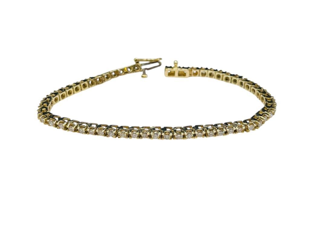 14K YELLOW GOLD DIAMOND TENNIS BRACELET FEATURING 55 ROUND BRILLIANT CUT DIAMONDS: 7 1/4" X 1/8", APPROX. 1.75CTTW DIAMONDS, 11.19 GRAMS