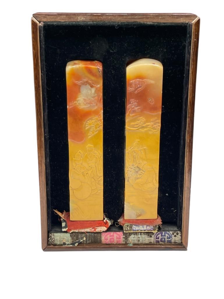 PAIR OF CARVED JADE ASIAN INSPIRED STAMPS "LESLIE SCOTT" AND "DOROTHY SCOTT": BOTH FEATURE NAME AND ASIAN CHOPMARK STAMP ON BOTTOMS OF JADE BLOCKS, IN ORIGINAL CASE WITH GLASS TOP, BOTH FEATURE CARVED ASIAN IMAGES IN RELIEF 4" EACH, 237.40 GRAMS