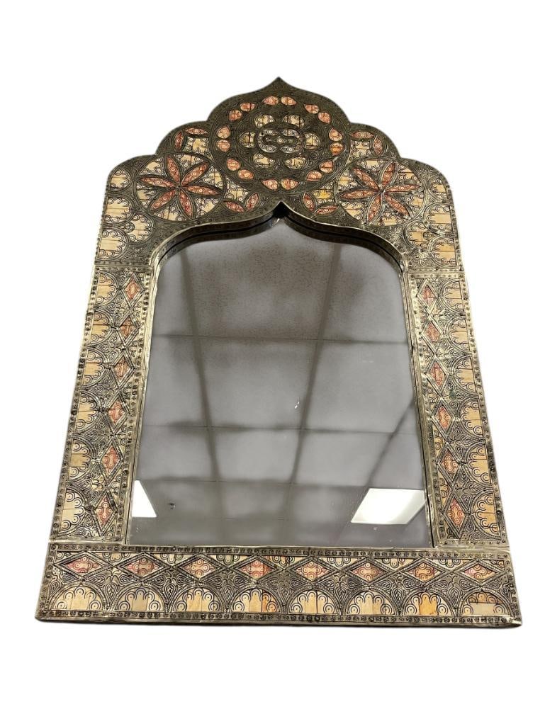 MOROCCAN STYLE MUGHAL BONE INLAY AND ENGRAVED METL OVERLAY MIRROR: CATHEDRAL SHAPED MIRROR WITH METAL OVERLAY AND CARVED BONE, FAUX BROWN PEBBLED LEATHER BACKING 23 1/2" X39"