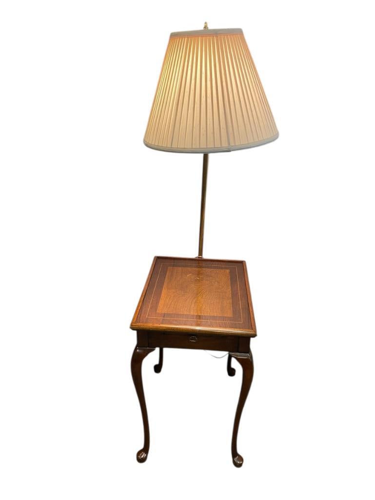 QUEEN ANN STYLE LAMP TABLE WITH WRITING PAD: FEATURES FLARED LEGS WITH QUEEN ANNE FEET, BRASS FINISH LAMP POLE, INCLUDES TEXTILE LAMP SHADE IN ANTIQUE WHITE 52 1/2" H, TABLE MEASURES 14 1/2" X 18 1/2" X 22 1/2"