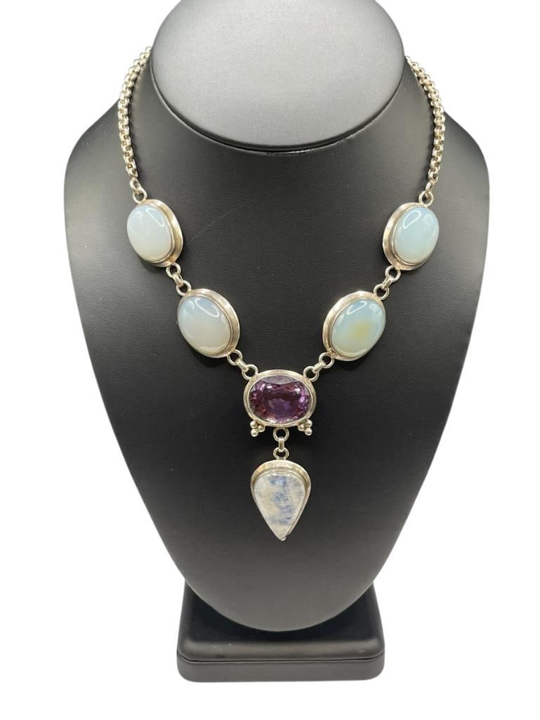 STERLING SILVER AMETHYST AND MOONSTONE PENDANT NECKLACE: FEATURING A PEAR SHAPED MOONSTONE ACCENTED BY AN OVAL CUT AMETHYST 14" NECKLACE WITH 2 1/2" DROP, 66.26 GRAMS