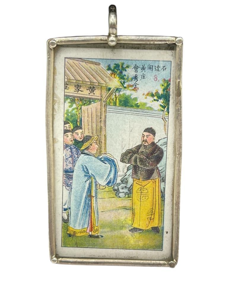 ANTIQUE CHINESE HWACHING TOBACCO CO. LTD. SHANGHAI STERLING SILVER PENDANT: TOBACCO CARD IS ENCASED IN STERLING SILVER AND GLASS PENDANT 2 3/4", 28.45 GRAMS