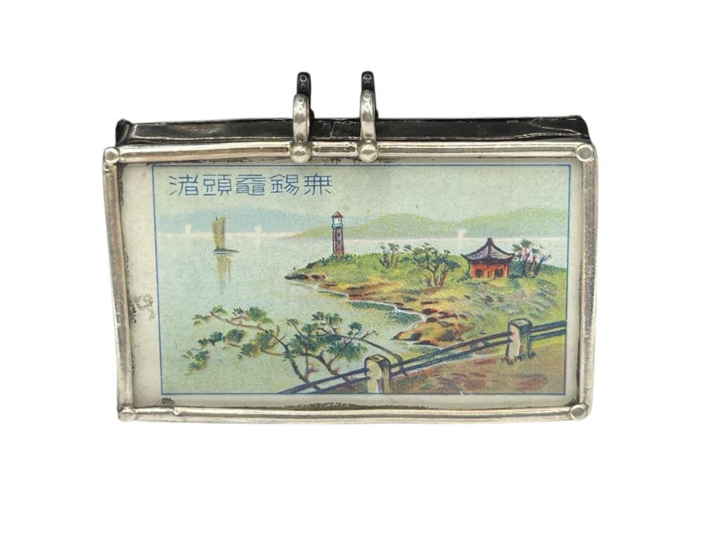 VINTAGE CHINESE :FLYING EAGLE" CIGARETTE TOBACCO CARD PENDANT: FEATURING DUAL BAIL DESIGN, TOBACCO CARD ENCASED IN STERLING AND GLASS PENDANT 2 5/8", 30.66 GRAMS