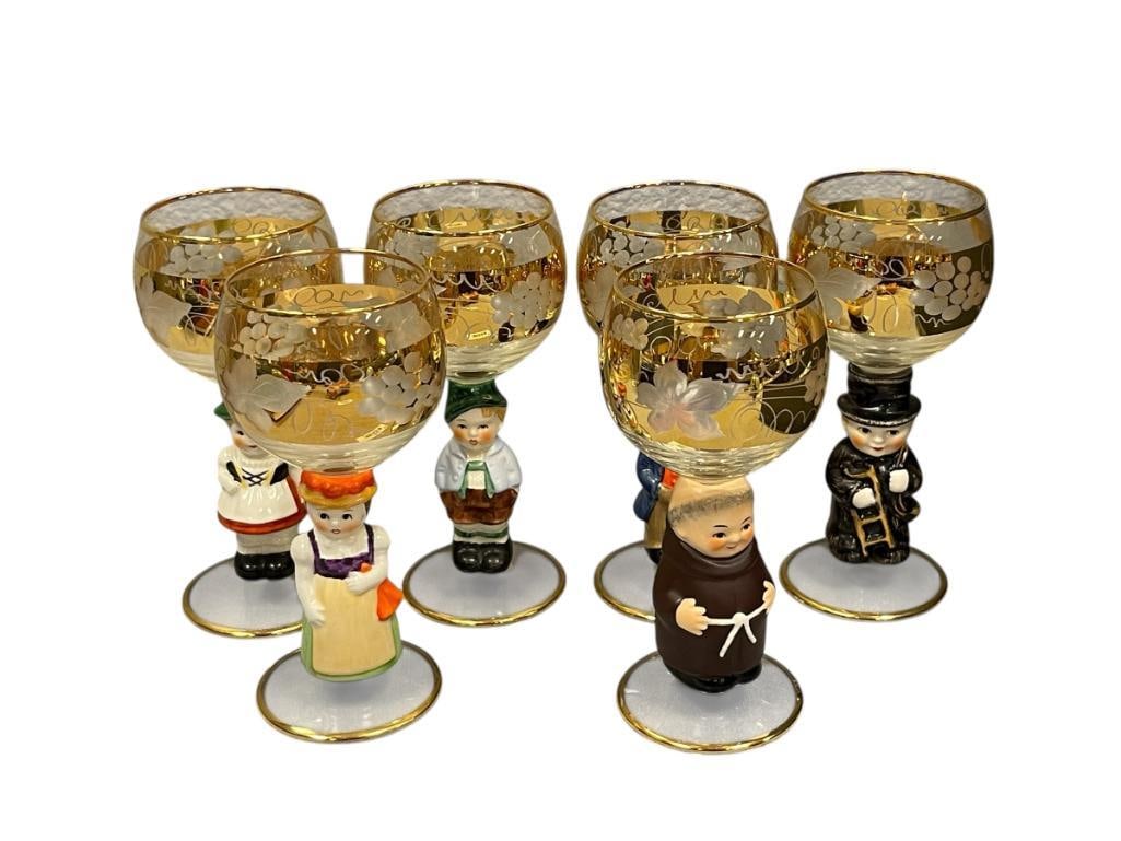 SET OF SIX GOEBEL HUMMEL GERMAN WINE / CORDIAL GLASSES: FIGURAL STEM HUMMEL WINE GLASSES WITH FLORAL ETCHED AND GILT DESIGN, MADE IN WESTERN GERMANY, NO CHIPS 5 7/8" H