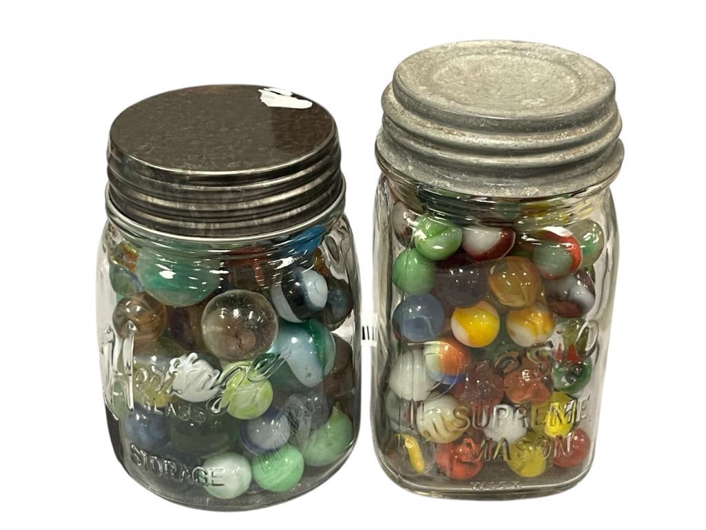 TWO VINTAGE EMBOSSED GLAS MASON JARS FILLED WITH VINTAGE MARBLES CAT-EYE, BOULDERS, CLEARIES: HERITAGE AND DRESTO MASON JARS WITH METAL AND ZINC TOPS, INCLUDES OVER 100 MARBLES, HERITAGE JAR HAS HOLE ON THE BOTTOM EDGE 4 3/4" AND 5 1/2" H JARS