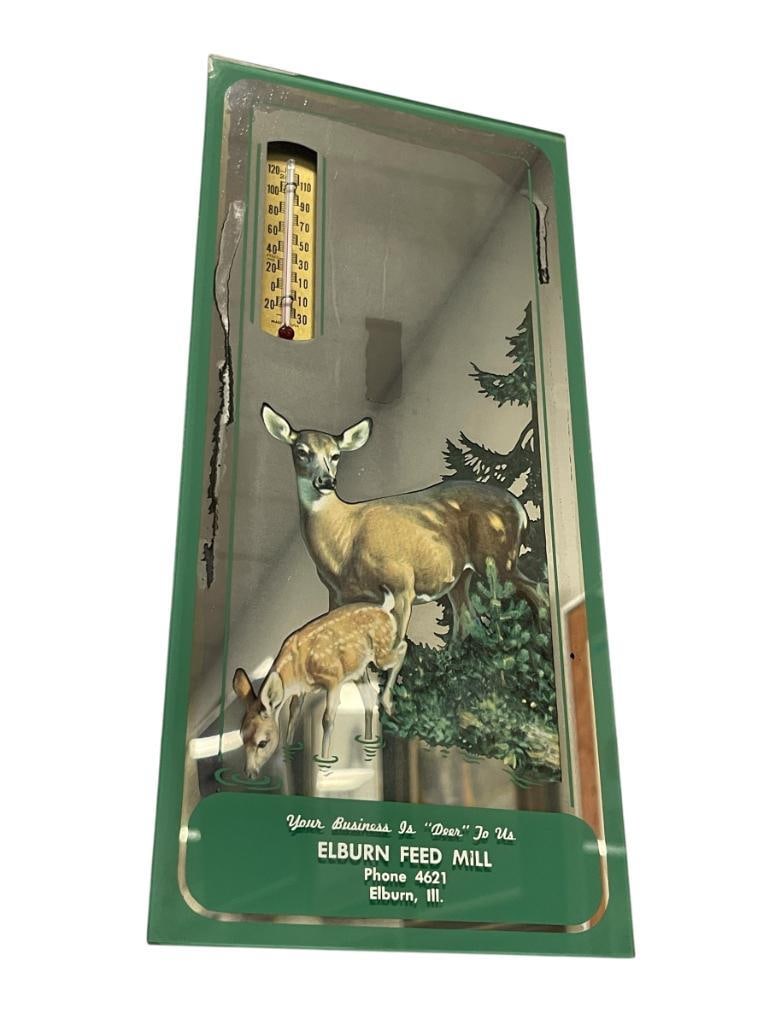 VINTAGE ELBURN FEED MILL ADVERTISMENT MIRRORED THERMOMETER WITH WILDLFIFE ILLUSTRATION: ELBURN, ILL. FOUR DIGIT PHONE NUMBER, SMALL CHIP TOP LEFT CORNER, MINOR WEAR TO MIRROR FINISH ALONG LEFT AND RIGTH EDGE5 1/2" X 12"