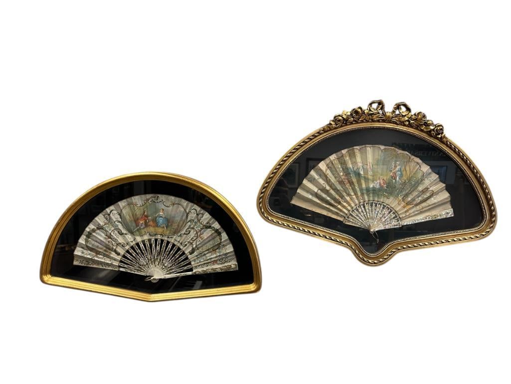 ANTIQUE VICTORIAN HAND PAINTED TEXTILE HAND FANS, ONE WITH MOTHER OF PEARL HANDLE: EACH FAN HAS FRENCH PROVINCIAL ROMANCE PAINTINGS, DECORATED WITH SEQUIN, BOTH IN FAN SHAPED FRAMES WITH BLACK CLOTH BACKING 20 5/8" X 12 1/4" AND 22 3/4" X 15 1/2" FRAME