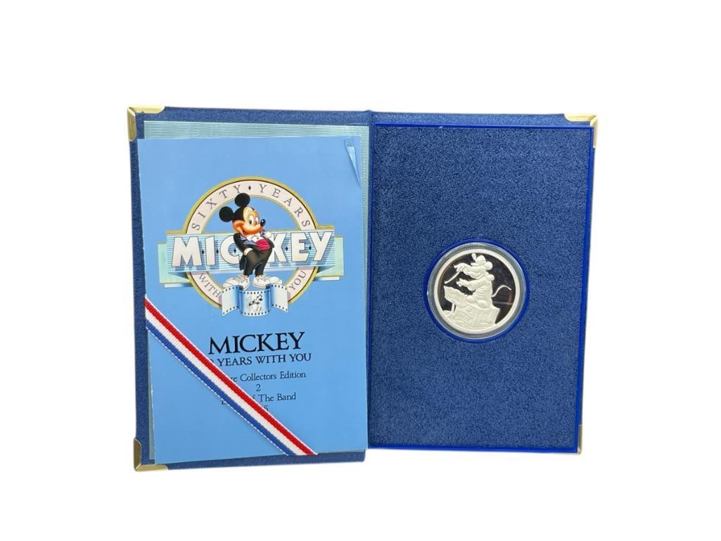 1988 DISNEY MICKEY 60 YEARS WITH YOU .999 FINE SILVER PROOF COIN: "LEADER OF THE BAND, 1935," EDITION, MINTED BY RARITIES MINT, SERIAL NO. 25316, LIMITED EDITION, INCLUDES ORIGINAL CASE, BOX, AND CERTIFICATE OF AUTHENTICITY 1 TROY OUNCE