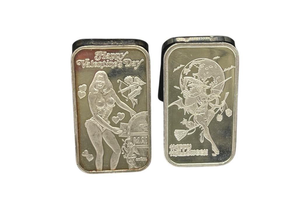 TWO PROVOCATIVE NUDE HOLIDAY THEME .999 FINE SILVER ART BARS INCLUDING VALENTINE'S DAY AND HALLOW...: BOTH FEATURE NUDE IMAGES OF BUSTY WOMEN, ONE MINTED BY DT MINT OF COCOA BEACH, FLORIDA AND OTHER BY CROWN MINT A LIMITED EDITION ISSUE FROM THE SERIES OF HOLIDAY BEAUTIES 1 TROY OUNCE EACH