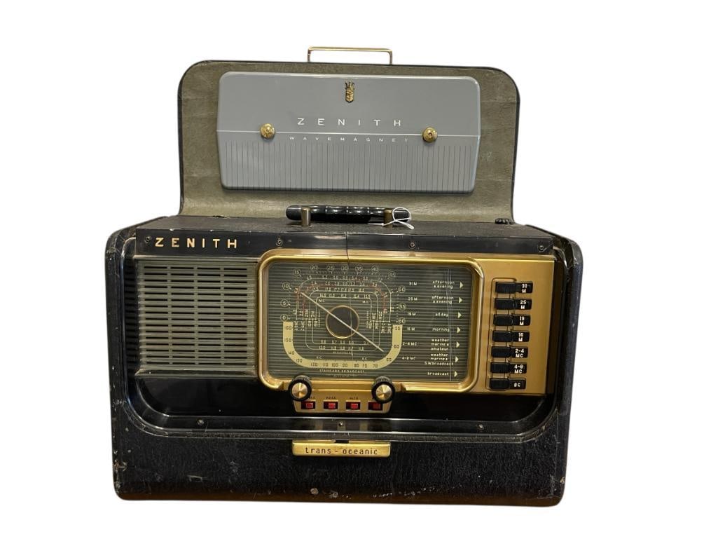 1958 ZENITH TRANS-OCEANIC PORTABLE TUBE WAVE MAGNET LOOP: AM, SHORTWAVE, LONGWAVE RADIO, BLACK TEXTILE WRAP, CHASIS NO. 5H40, ACRYLIC COVER IS CRACKED, POWERS ON, EXTERIOR DOES SHOW WEAR 17" X 7 1/2" X 11"