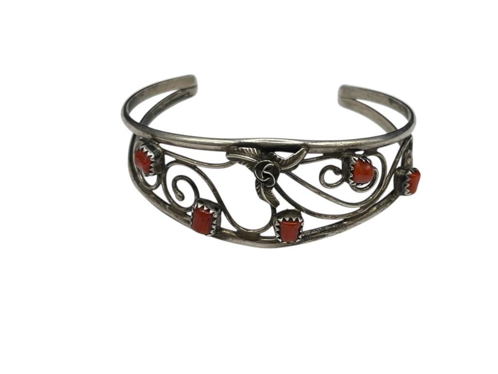 VINTAGE NAVAJO SIGNED STERLING SILVER CORAL CUFF BRACELET: FEATURING A FOLIATE DESIGN WITH FIVE CORALS, SIGNED "C" BY ARTIST 2 1/4" CUFF WIDTH, 7/8" FRONT, 12.49 GRAMS