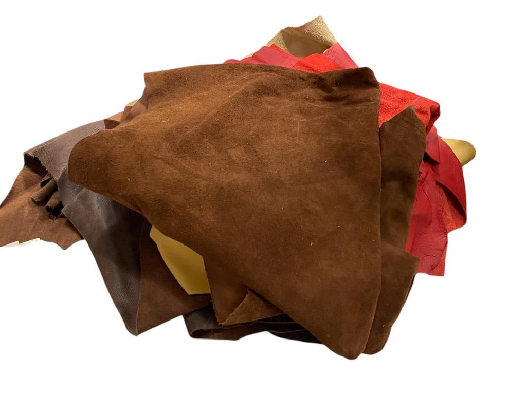 ASSORTED LEATHER SCRAPS INCLUDING DYED RED LEATHER: VARIOUS LENGTHS