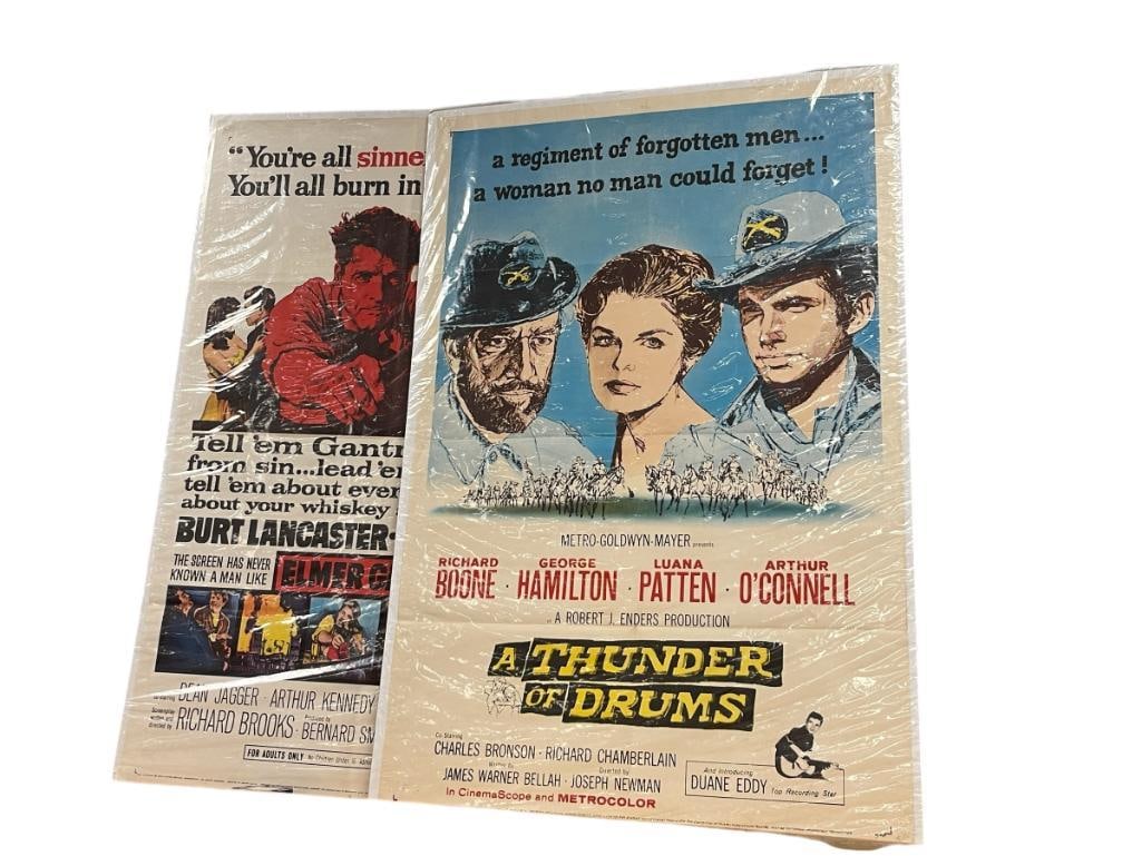 1960 ELMER GANTRY AND 1961 A THUNDER OF DRUMS VINTAGE MOVIE POSTERS: 1960 UNITED ARTISTS ELMER GANTRY MOVIE POSTER AND 1961 MGM A THUNDER OF DRUMS STARRING RICHARD BOONE, GEORGE HAMILTON, BOTH SHOW CREASES AND PIN HOLES IN THE CORNERS, UNFRAMED 27" X 41"
