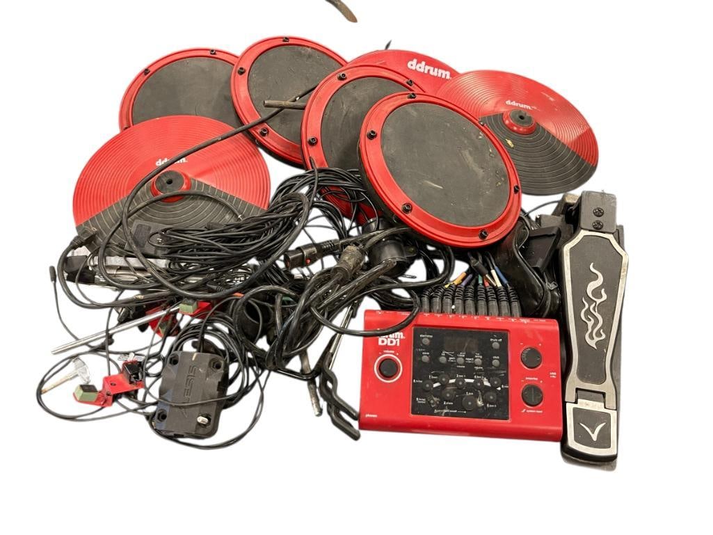 DDRUM DD1 ENTRY LEVEL ELECTRONIC DRUM KIT: INCLUDES MODULE AND FOUR RUBBER PADDED AND THREE PADDED SYMBOLS, INCLUDES A DRUM PEDAL, CORDS, AND SOME HARDWARE