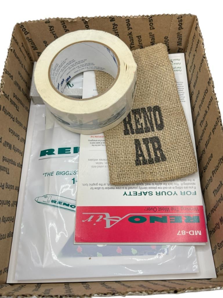 1990'S RENO AIR AIRLINE COLLECTIBLE MEMORABILIA INCLUDING MD-80 1:600 SCALE MINI MODEL: ALSO INCLUDES PINS, BUTTONS, KEY-CHAINS, IN-FLIGHT SECURITY CARDS FOR MD-87 MD-82/83/84, LUGGAGE TAGS, POST CARDS, AND MORE