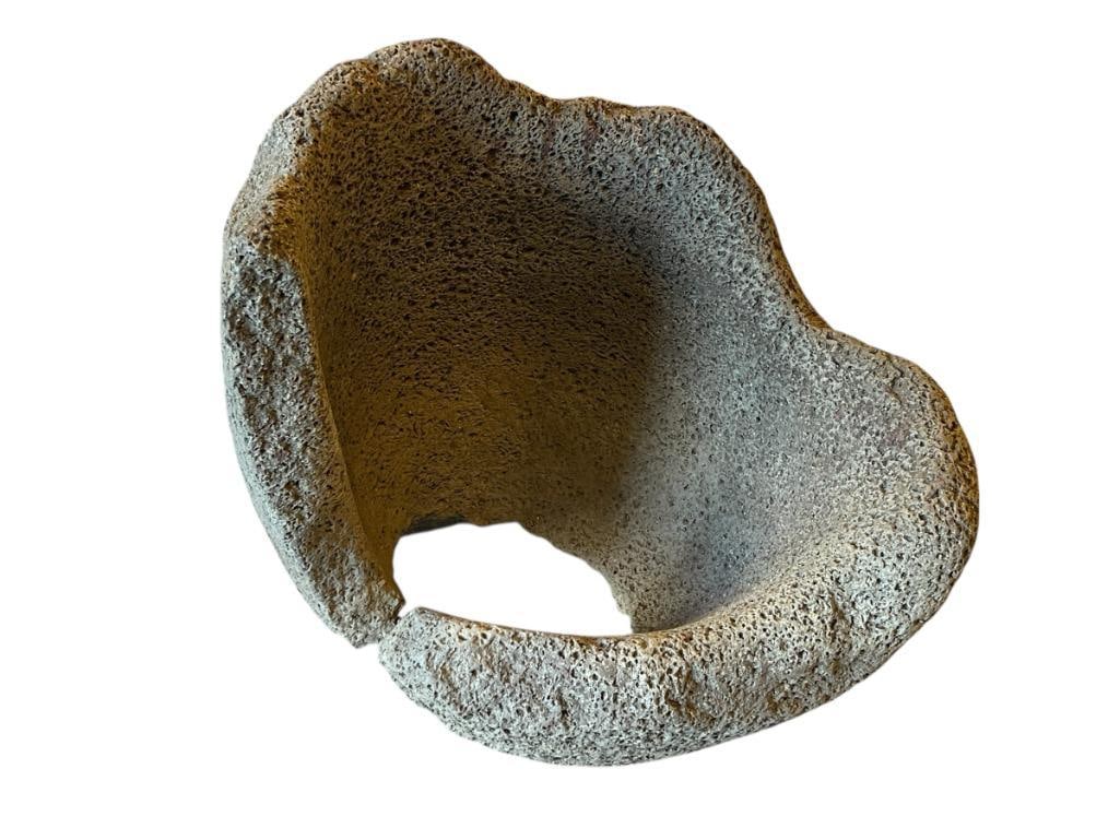 MASSIVE PRIMITIVE NATIVE AMERICAN ARTIFACT METATE / PESTLE: METATE LIKELY MADE FROM VOLCANIC PUMICE, BELIEVED TO HAVE BEEN FOUND IN NORTHERN CALIFORNIA, NORTHERN NEVADA REGION, METATE SHOWS LARGE PORES AND HEAVY SIGNS OF USE WITH EXPOSED BOTTOM ROUGHLY 12" ROU