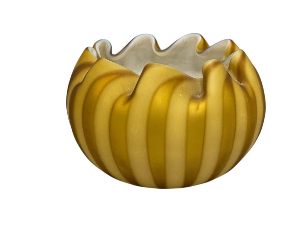 ANTIQUE THOMAS WEBB AND SONS HAND BLOWN ART GLASS AMBER AND YELLOW BOWL WITH RUFFLED RIM: RIBBED BOWL WITH RUFFLED RIM, THOMAS WEBB AND SONS FOUNDED IN 1837 IN STOURNRIDGE, ENGLAND, NO CHIPS OR CRACKS 3 3/4" ROUND