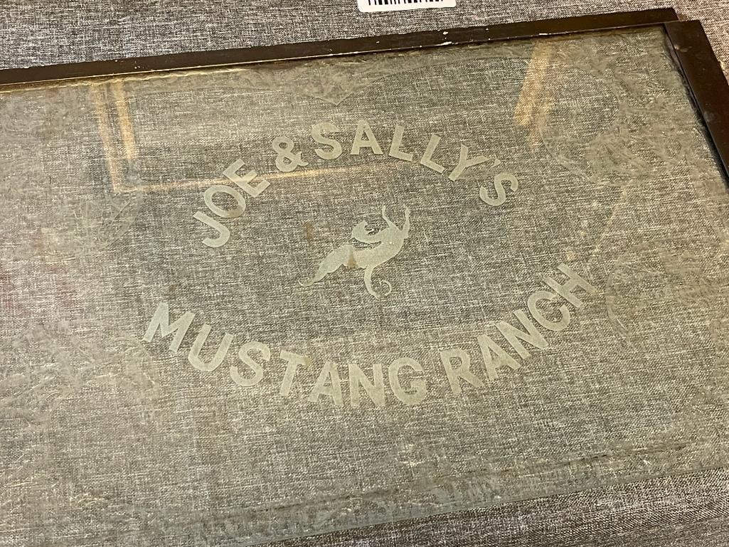 HISTORICAL NEVADA BROTHEL MEMORABILIA JOE & SALLY MUSTANG RANCH ENTRY GLASS, REVOLVER, MONEY CLIP: FAMOUS MUSTANG RANCH BROTHEL MEMORABILIA FROM JOE CONFORTE AND SALLY BURGESS WHICH WAS TAKEN OVER IN 1967, ITEMS INCLUDED ARE A HARRINGTON & RICHARDSON ARMS CO. 32. S&W REVOLVER SERIAL 323065,