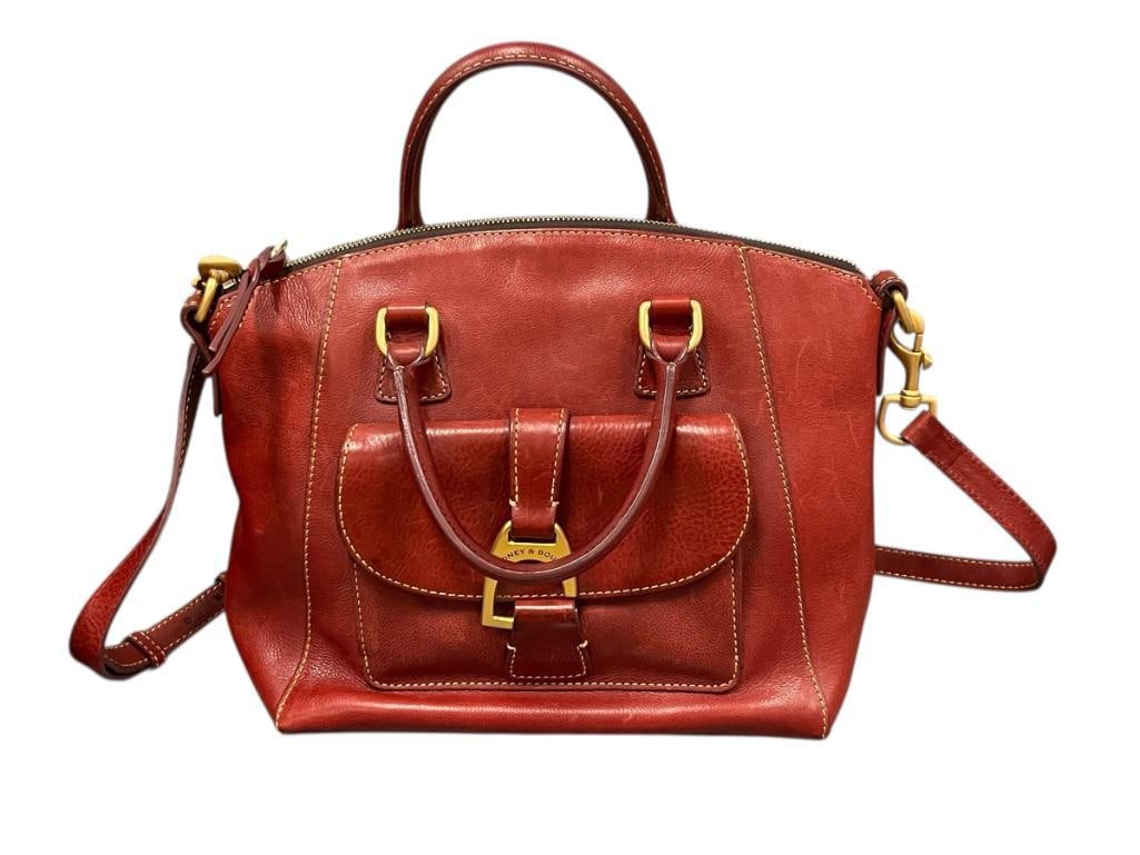 DOONEY BOURKE FLORENTINE NAOMI GENUINE RED LEATHER SATCHEL WITH SHOULDER STRAP: 2-WAY SATCHEL WITH REMOVABLE SHOULDER STRAP, FEATURES BRASS TONED HARDWARE WITH HOOK AND LOOP BUCKLE, OVERALL IN GOOD USED CONDITION WITH NO MAJOR SIGNS OF USE 11" X 6" X 8"