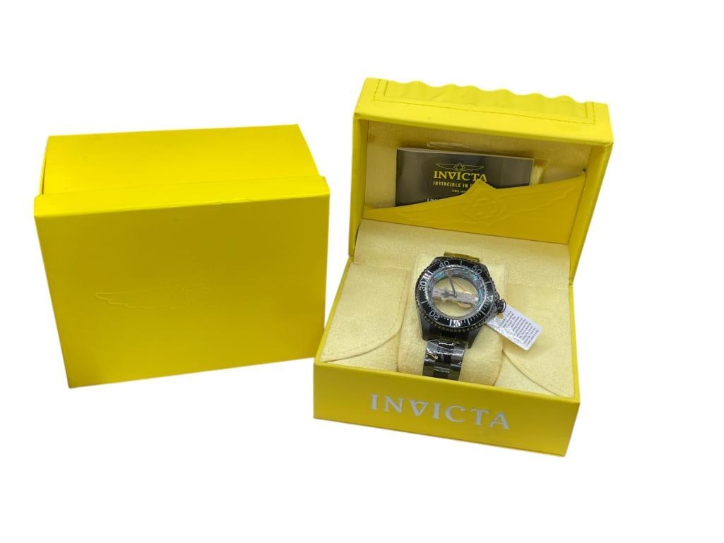 NEW MEN'S INVICTA PRO DIVER MECHANICAL WRISTWATCH FEATURING UNIQUE SKELETON DESIGN DIAL: INCLUDES ORIGINAL CASE, BOX, AND PLASTIC WRAP ON WATCH, MODEL NO. 26411, 100M WATER RESISTANT, BLACK STAINLESS STEEL CASE AND BAND, ORIGINAL RETAIL PRICE OF $795.00, RUNNING CONDITION 47MM CASE