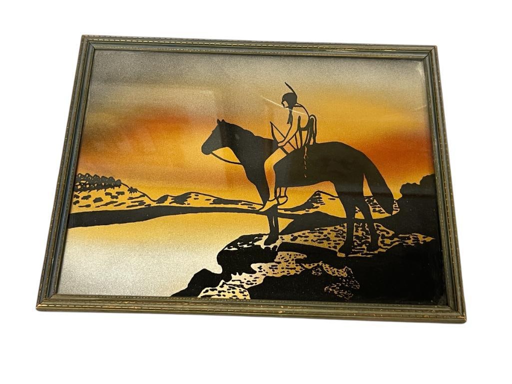 20TH CENTURY SILHOUETTE OF A NATIVE AMERICAN ON HORSEBACK WITH SILVER / GOLD HUE BACKGROUND: 12 3/4" X 9 1/2" FRAMED 