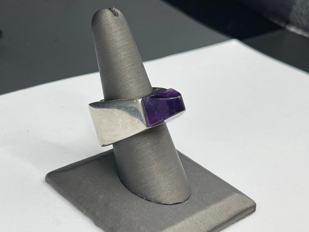 VINTAGE PIANEGONDA DESIGNER SIGNED STERLING SILVER TRILLION SHAPED AMETHYST RING: FEATURING UNIQUELY SHAPED RING WITH PYRAMID AMETHYST AT TOP SIZE 8, 5/8" BADE TAPERS TO 1/4" AT TOP, 22.04 GRAMS 
