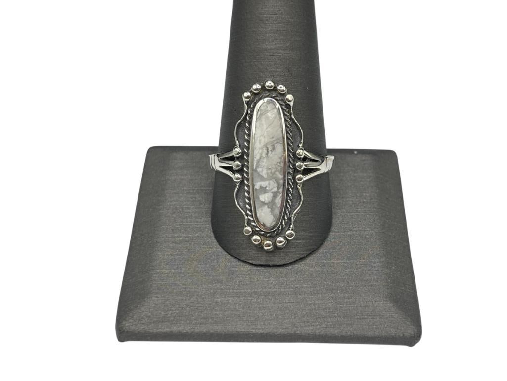 NATIVE AMERICAN DESIGN STERLING SILVER WHITE BUFFALO RING: HALLMARKED BY ARTIST SIZE 12, 1 1/8" FRONT, 7.24 GRAMS