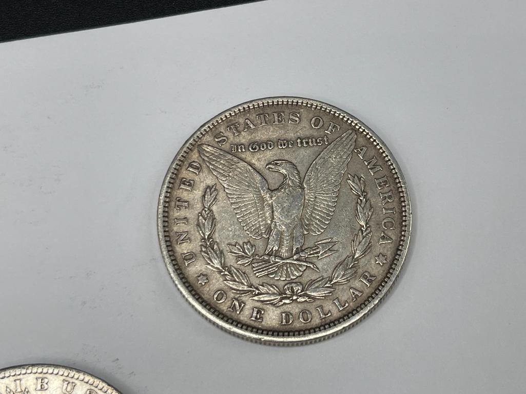 FIVE U.S. MORGAN SILVER DOLLARS FEATURING VARIOUS DATES AND MINT MARKS - 6