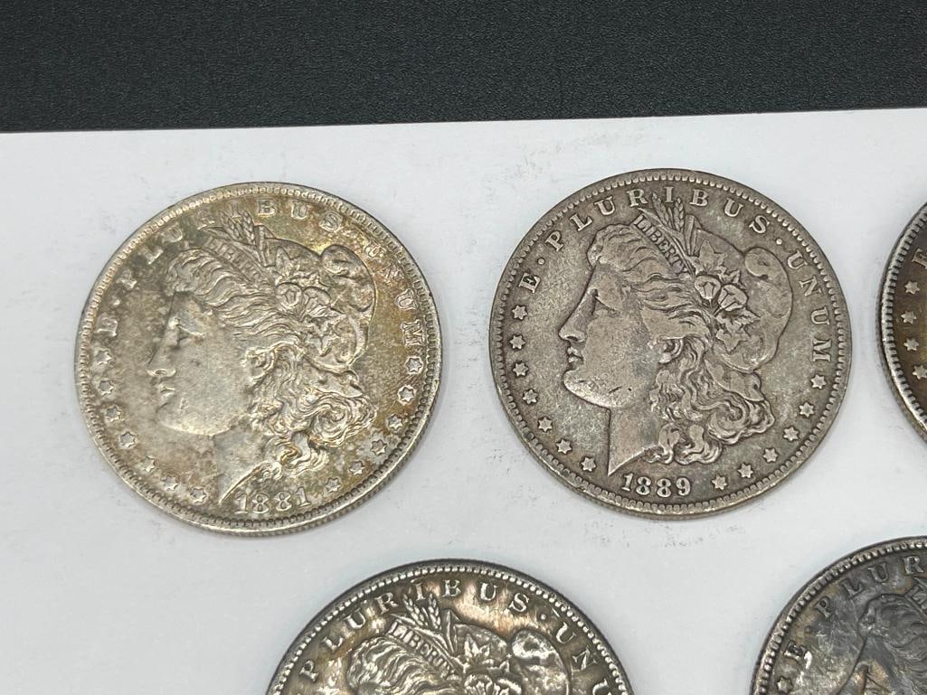 FIVE U.S. MORGAN SILVER DOLLARS FEATURING VARIOUS DATES AND MINT MARKS - 2
