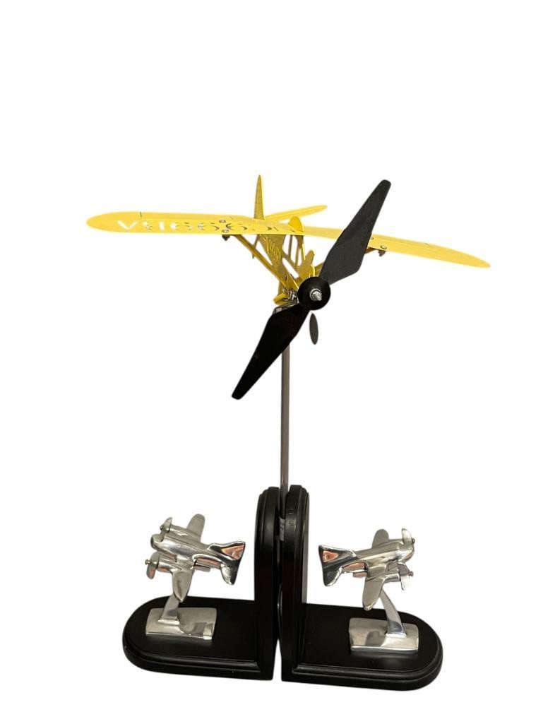 DIE-CUT METAL AIRPLANE GARDEN STAKE AND PIER 1 ART DECO STYLED POLISHED AIRCRAFT BOOKENDS: VIBRANT YELLOW METAL AIRCRAFT GARDEN STAKE, WOOD AND METAL BOOKENDS 17" H GARDEN STAKE, 7" H BOOKENDS 
