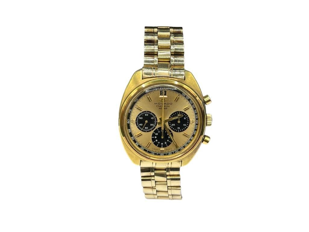 VINTAGE 1970'S MOVADO DATRON HS 360 CHRONOGRAPH WRISTWATCH: FEATURING A GOLD PLATED CASE WITH GOLD AND BLACK DIAL, SWISS MADE, IN RUNNING CONDITION, FEATURES ZENITH EL PRIMERO CALIBRE 3019 PHC, GOLD TONE STAINLESS STEEL BAND AND CASE, DATEJUST 37MM CASE